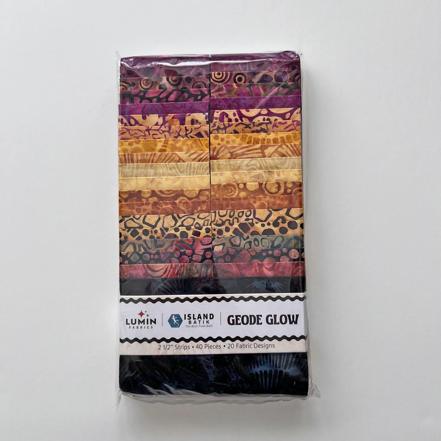 Geode Glow Strip Pack, Island Batik, Batik Jelly Roll, 2.5" Precut Fabric Strips, Purple Amber Fossils Batik Fabric Strips