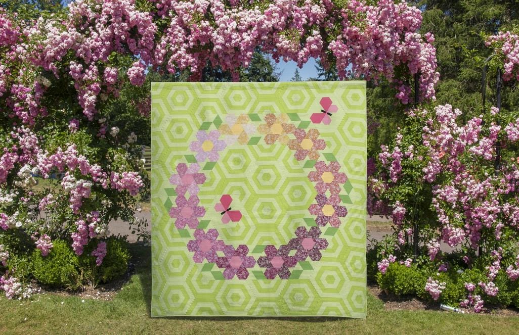 The Flutterby Frolic Quilt Pattern, The Quilted Life TQL10031, Yardage Friendly Spring Floral Wreath Lap Quilt Pattern, 60 Diamond Ruler