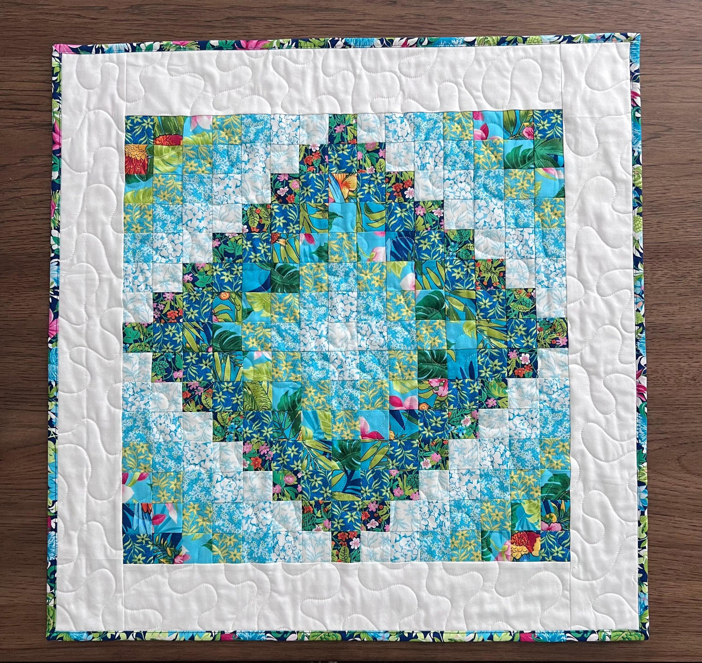 Tropical Trip Around the World Quilted Table Topper, 24.25" x 24.5", Handmade Blue Green Pink White Tropical Parrot Table Topper Quilt