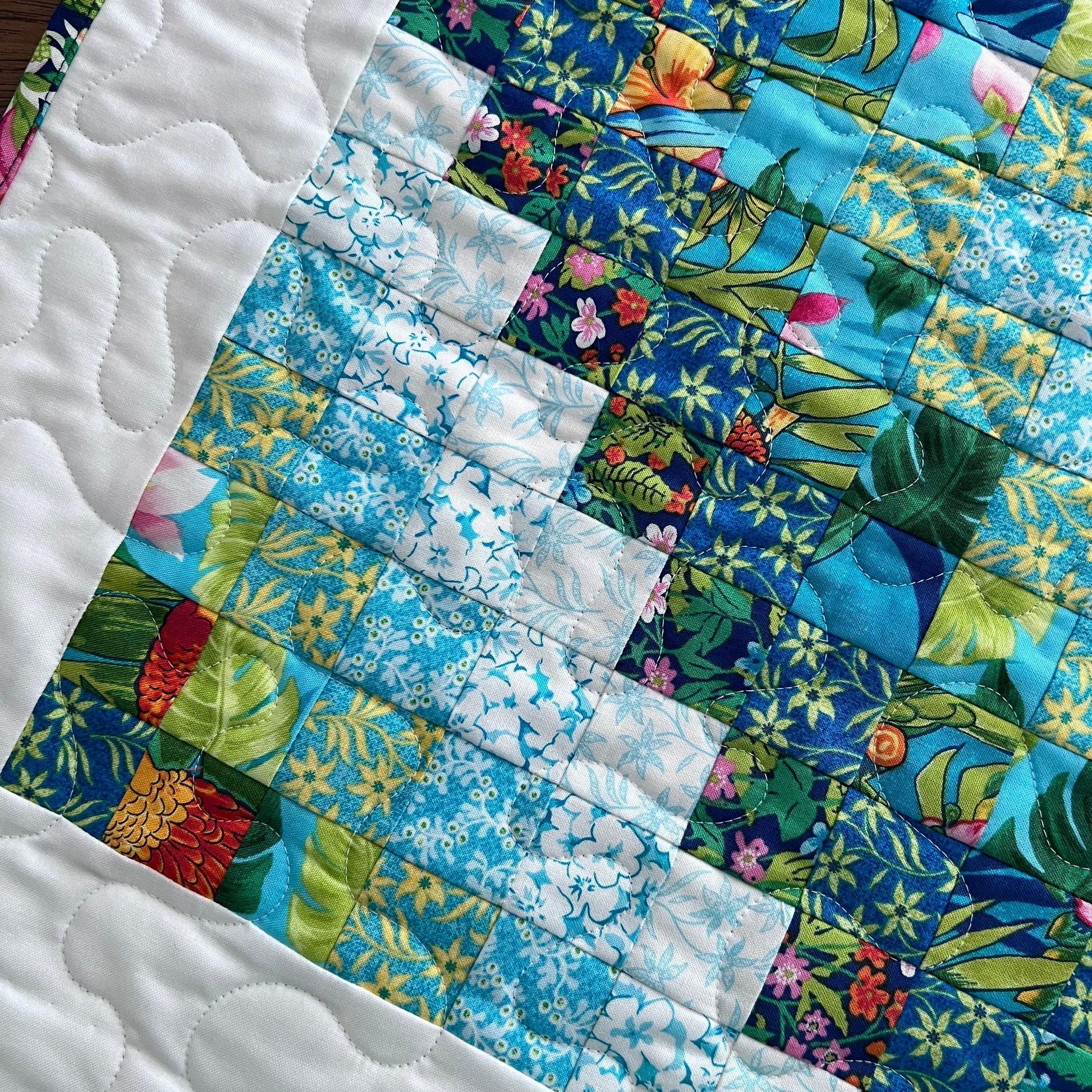 Tropical Trip Around the World Quilted Table Topper, 24.25" x 24.5", Handmade Blue Green Pink White Tropical Parrot Table Topper Quilt